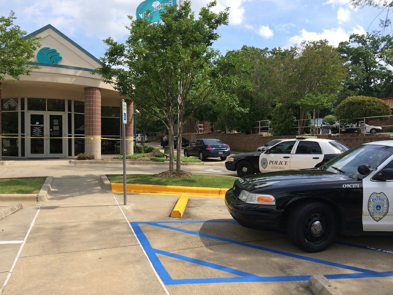Little Rock police respond Tuesday, May 27, 2014, after a robbery of the First Security Bank branch at4 936 W. Markham St.