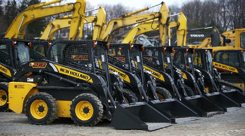 Earthmoving and construction equipment is stored on a lot at the Highway Equipment Co. in Zelienople, Pa., in March. Orders for long-lasting durable goods rose in April, the Commerce Department said Tuesday. 