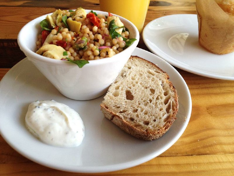 Mylo Coffee Co.’s Couscous Salad comes with a dab of Greek yogurt dressing and bread. 
