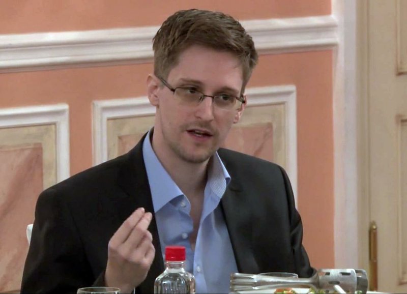 In this image made from video released by WikiLeaks on Friday, Oct. 11, 2013, former National Security Agency systems analyst Edward Snowden speaks during a presentation ceremony for the Sam Adams Award in Moscow, Russia. Should Snowden ever return to the U.S., he would face criminal charges for leaking information about NSA surveillance programs. But legal experts say a trial could expose more classified information as his lawyers try to build a case in an open court that the operations he exposed were illegal.  (AP Photo)