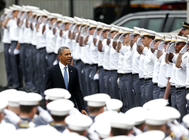 President Barack Obama arrives to cadets’ salutes Wednesday at the U.S. Military Academy in West Point, N.Y. 