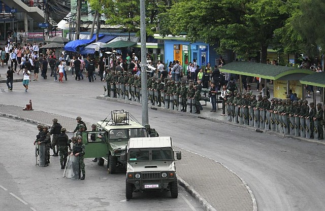 Thai soldiers secure an area at a bus stop to prevent an anti-coup demonstration Thursday in Bangkok. 