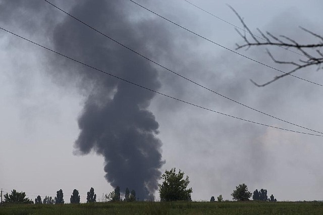 Smoke rises from a Ukrainian army helicopter shot down by pro-Russia rebels Thursday outside Slovyansk. 