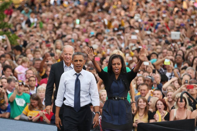 U.S. Vice President Joe Biden, President Barack Obama and first lady Michelle Obama campaign during a rally at the University of Iowa in 2012. (Photo by Chip Somodevilla/Getty Images)
