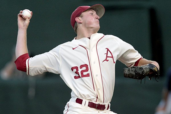 In this file photo Arkansas pitcher Zach Jackson (32) throws in the first inning of an NCAA college baseball regional tournament game against Virginia, Sunday, June 1, 2014, in Charlottesville, Va. 