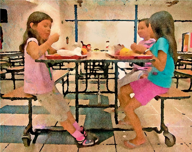 The Fayetteville School District’s USDA Seamless Summer feeding program provides free lunches from 11 a.m. to 1 p.m. Monday through Friday from June 11 to Aug. 2 to all children up to age 18 — no application or registration required. The program is moving this year from Owl Creek Elementary School to Holt Middle School. In this photo from 2012, Tina Bowlin, food service manager at Owl Creek, pulls a tray of blackberries from a cooler before summer lunch. Photo illustration from NWA Images file photo by SPENCER TIREY.