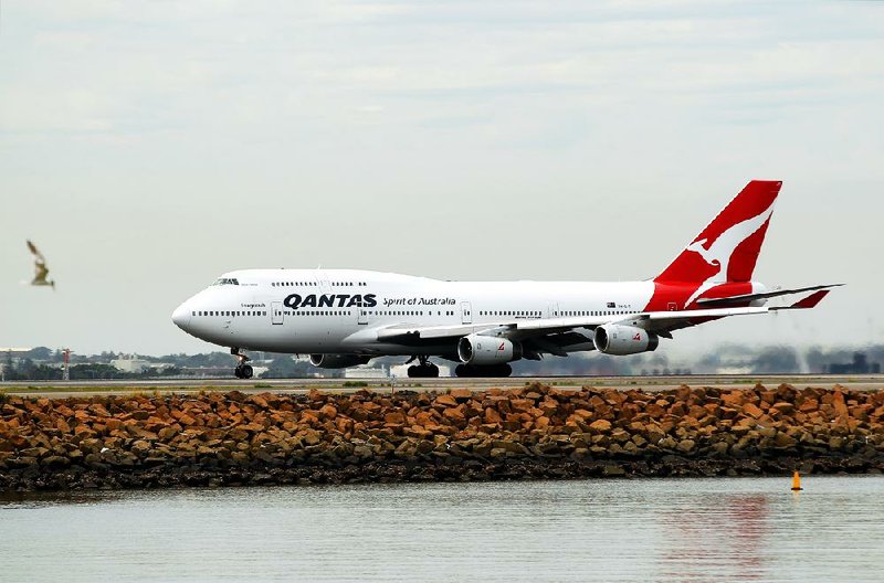A Boeing Co. 747 aircraft operated by Qantas Airways Ltd. lands at Sydney Airport in this file photo. The 747 is nearing the end of production as airlines switch to more fuel-efficient planes.