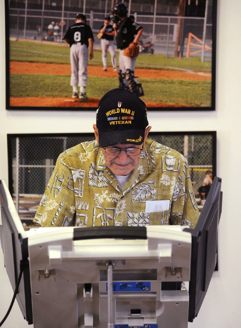 Gene Eber votes in the party primary at the Oxford Park Commission in Oxford, Miss. on Tuesday. 