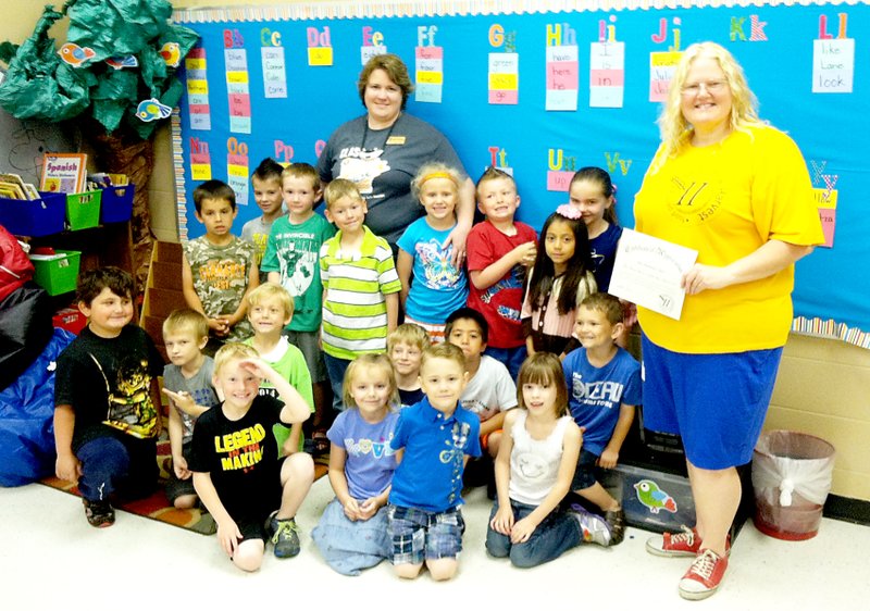 Submitted Photo Share the Harvest Food Pantry, represented by Terry King, presented Mrs. Norberg&#8217;s kindergarten class at Glenn Duffy Elementary School in Gravette with a certificate of appreciation for gathering the most jars of peanut butter and jelly in the school.