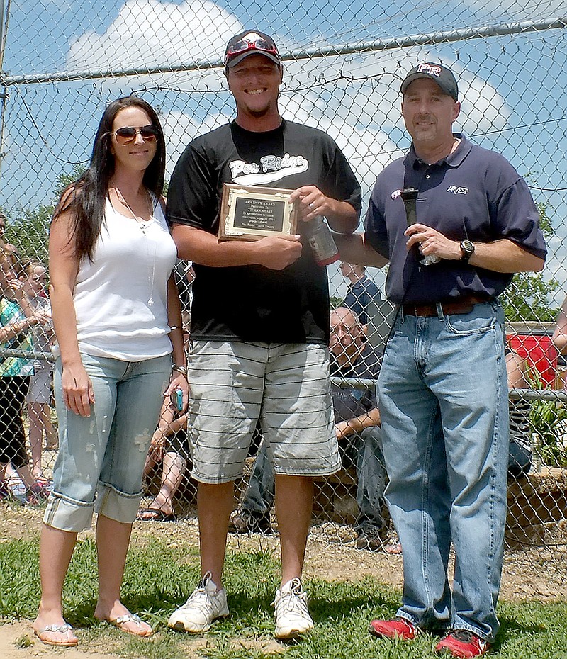 Tony and Samantha Young, owners of ATTC Lawncare, were presented the Sam Spivey Volunteer award by Jeff Neil, chairman of the board of directors for Pea Ridge Youth Sports. Neil said the Youngs mowed the fields all season. &#8220;We really appreciate what they&#8217;ve done,&#8221; Neil said.