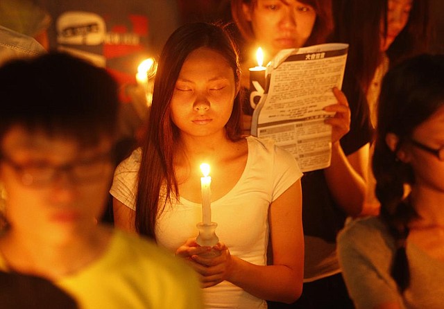 Tens of thousands of people attend a candlelight vigil Wednesday at Victoria Park in Hong Kong to mark the 25th anniversary of the Chinese military crackdown on the pro-democracy movement in Beijing. 