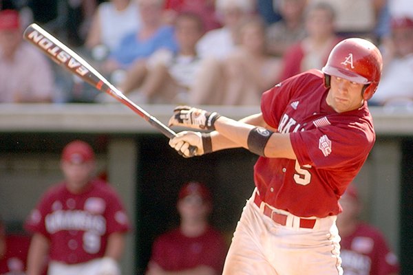 Arkansas' Brady Toops hits a grand slam in the ninth inning against Wichita State in the NCAA regional tournament in Fayetteville on Sunday, June 6, 2004. (AP Photo/Neemah Aaron)