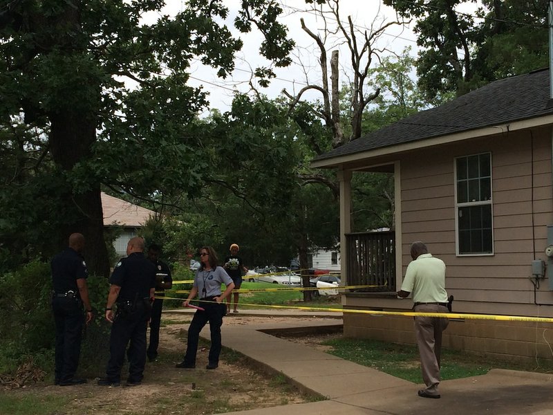Little Rock police officers investigate a shooting at 723 S. Maple St. on Thursday, June 5, 2014.

