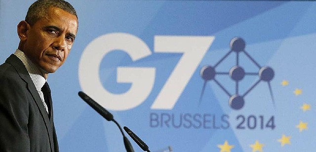 President Barack Obama listens as British Prime Minister David Cameron speaks during a news conference Thursday at the G-7 summit in Brussels.