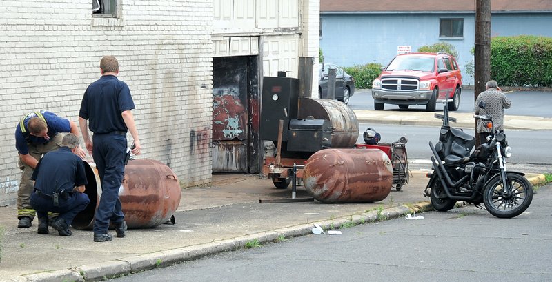 The Sentinel-Record/Mara Kuhn TANK EXPLOSION: Emergency personnel investigate a propane tank explosion at the intersection of Sixth Street and Hobson Avenue that fatally injured a man around 9:30 a.m. Thursday. According to Hot Springs police, Phillip Landry, 66, later died at St. Vincent Hot Springs as a result of injuries sustained in the explosion.