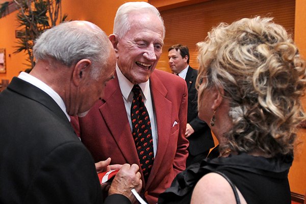 Frank Broyles greets friends and supporters during the reception prior to a banquet in his honor at the John Q Hammons Center in Rogers on Saturday June 7, 2014. 