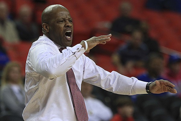 Arkansas coach Mike Anderson yells instructions to his players Wednesday, March 13, 2014 during their SEC Tournament game against South Carolina at the Georgia Dome in Atlanta.