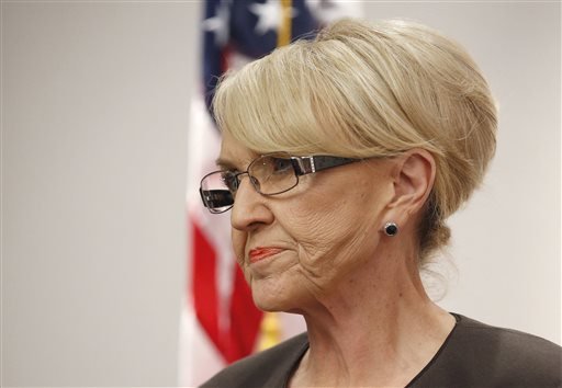 In this Feb. 26, 2014, file photo, Arizona Gov. Jan Brewer appears at a press conference at the Arizona Capitol in Phoenix. Irate about the federal government sending from Texas to Arizona immigrants who are in the country illegally, Arizona officials are rushing federal supplies to a holding center in the southern part of the state that's housing migrant children. Gov. Jan Brewer's spokesman, Andrew Wilder, said Friday June 6, 2014, that conditions at the holding center are so dire that federal officials have asked the state to immediately ship the medical supplies to the center in Nogales.