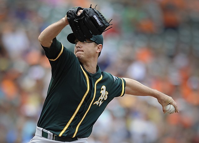 Oakland Athletics pitcher Scott Kazmir delivers against the Baltimore Orioles in the first inning of a baseball game Sunday, June 8, 2014, in Baltimore. 