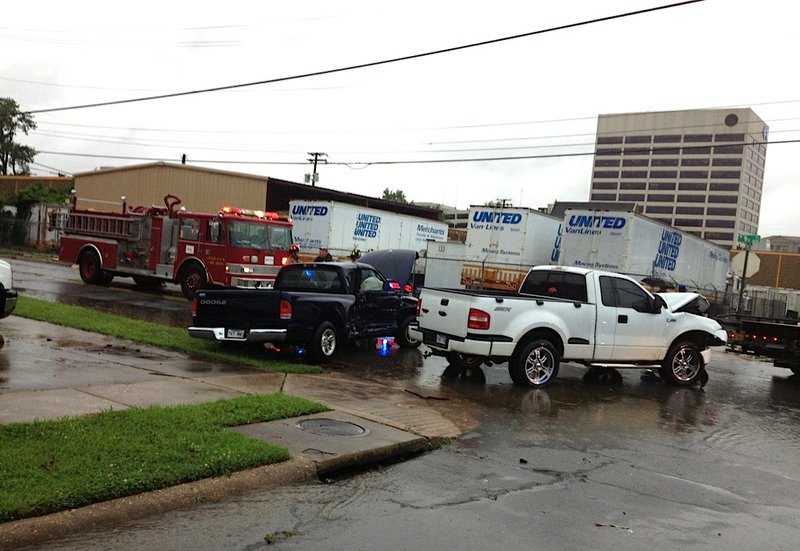 Emergency officials respond to a multi-vehicle accident at Ninth and Arch streets in Little Rock on Monday, June 9, 2014.