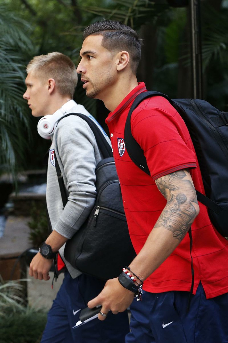 U.S. soccer players Geoff Cameron (right) and Aron Johannsson arrive at the team hotel in Sao Paulo, Brazil, on Monday. The U.S. will play in group G of the 2014 soccer World Cup.