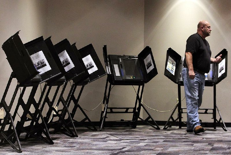 Pete Hornibrook cast a ballot Monday in Little Rock during the final day of early voting. Today is runoff election day.