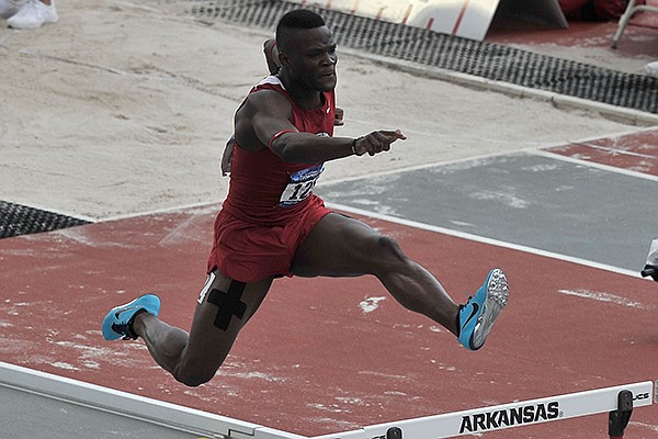 Arkansas hurdler Omar McLeod competes in the 400 meter hurdles Thursday, May 29, 2014 during the NCAA Track and Field West Preliminary meet at John McDonnell Field in Fayetteville.