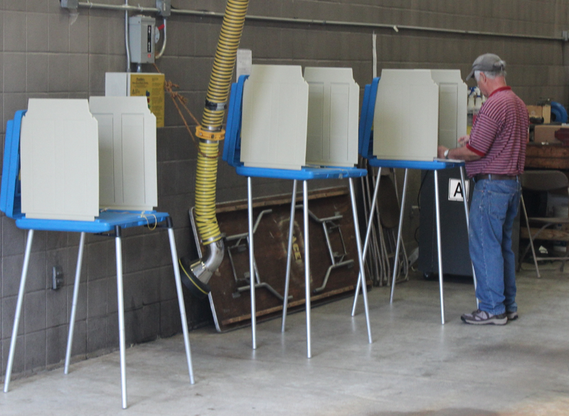 A voter casts a ballot Tuesday morning at Fire Station No. 10 in Little Rock's Heights neighborhood.