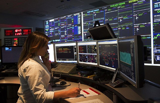 Grid operator Renae Slatki works at the PacifiCorp Transmissions Grid Operations center in Portland, Ore., last month. PacifiCorp is a unit of Warren Buffet’s Berkshire Hathaway Energy.