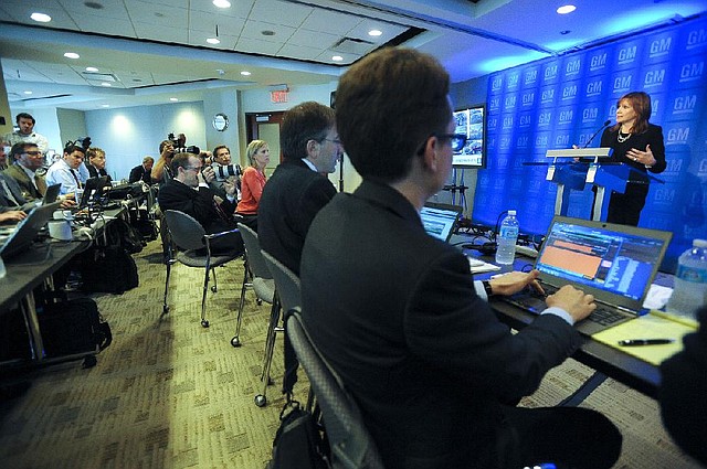 Mary Barra, chief executive officer of General Motors, talks to reporters Tuesday before the company’s annual meeting at its headquarters in Detroit.