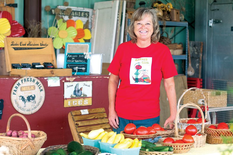 Cheryl Anderson, owner and operator of Garden Girl Farm Fresh Produce and More, is shown with a variety of produce at her stand off Batesville Boulevard. Anderson is one of the vendors participating in the Main Street Farmers Market in Batesville in its inaugural season.
