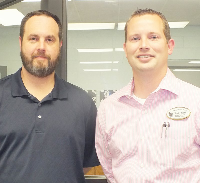 TIMES photograph by Annette Beard Jared Ross, left, was welcomed as the new instructor for plastic and metal fabrication for the Pea Ridge Manufacturing and Business Academy by director Charley Clark.