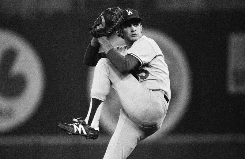 In this Oct. 4, 1978 file photo, Los Angeles Dodgers pitcher Bob Welch winds up to throw to the Philadelphia Phillies in a National League playoff game at Philadelphia. Welch, former All-Star pitcher with the Los Angeles Dodgers and the Oakland Athletics has died.  The two-time All-Star and Cy Young award winner was found dead at his home in Seal Beach, Calif. He was 57.