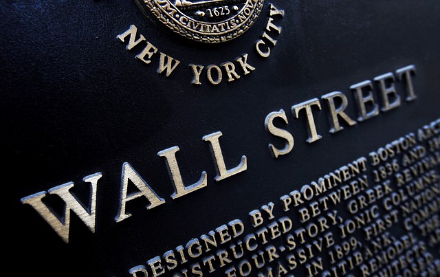 This Jan. 4, 2010 file photo shows an historic marker on Wall Street in New York. The stock market drifted lower Tuesday, June 10, 2014, after major indexes reached another record high the day before.