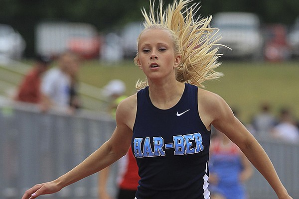 Amanda Dillon, from Springdale Har-Ber, set a new 7A state record of 55.475 in the girls 400m dash at the State 7A track championship Thursday, May 8, 2014 in Cabot. 