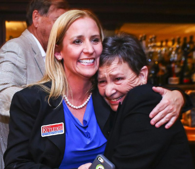 Leslie Rutledge celebrates with her mother, Nancy, at her watch party Tuesday night in Little Rock as early returns show her winning the runoff for the Republican nomination for attorney general.