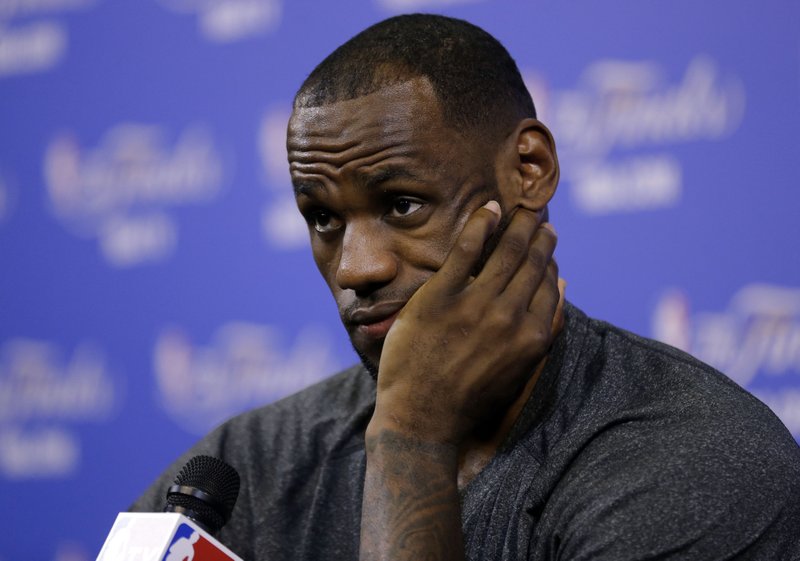 Miami Heat's LeBron James listens to a question during an NBA basketball media availability at the NBA Finals, Wednesday, June 11, 2014, in Miami. The San Antonio Spurs lead the Heat 2-1 in the best-of-seven games series. 