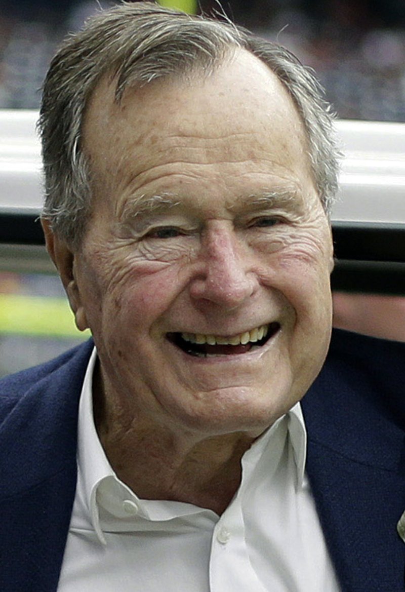 In this Nov. 4, 2012, file photo, former president George H.W. Bush pauses for a photo before an NFL football game in Houston between the Buffalo Bills and the Houston Texans.