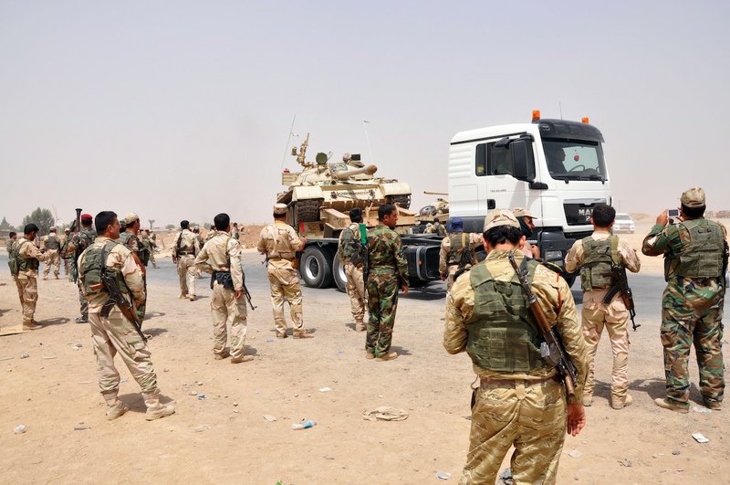 Kurdish security forces deploy outside of the oil-rich city of Kirkuk, 180 miles north of Baghdad on Thursday, June 12, 2014. The al-Qaida-inspired group that captured two key Sunni-dominated cities in Iraq this week vowed on Thursday to march on to Baghdad, raising fears about the Shiite-led government's ability to slow the assault following the insurgents' lightning gains.