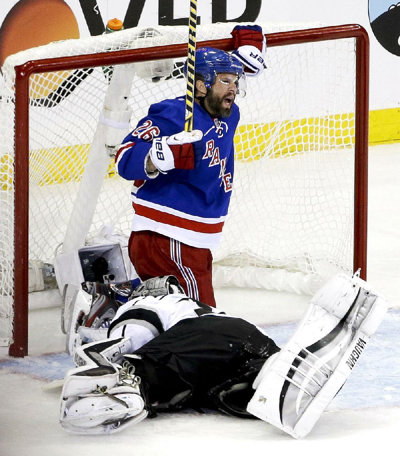 Martin St. Louis of the New York Rangers reacts after scoring a goal against Los Angeles Kings goalie Jonathan Quick on Wednesday night in Game 4 of the Stanley Cup final.