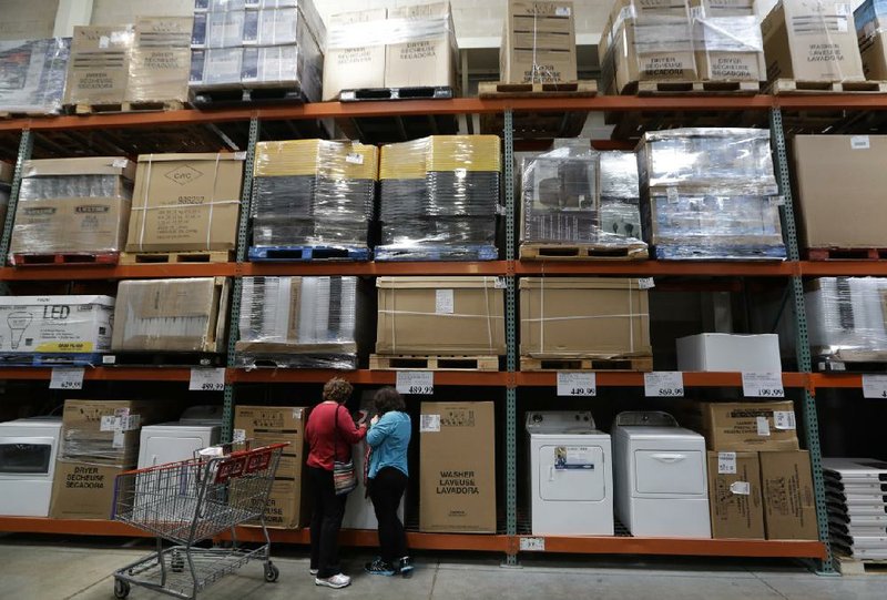Shoppers look at washers and dryers at a Costco warehouse store in Plano, Texas, on June 4. Business inventories rose 0.6 percent after a 0.4 percent March gain, the Commerce Department reported Thursday.