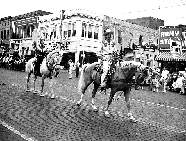 COURTESY PHOTO Building its 80-year tradition, the Old Fort Days Rodeo rides the trail in the 1955 rodeo parade through historic downtown Fort Smith. This year&#8217;s rodeo has already wrapped up, but the &#8220;Ready to Rodeo&#8221; exhibit continues through the summer at the Fort Smith Museum of History.