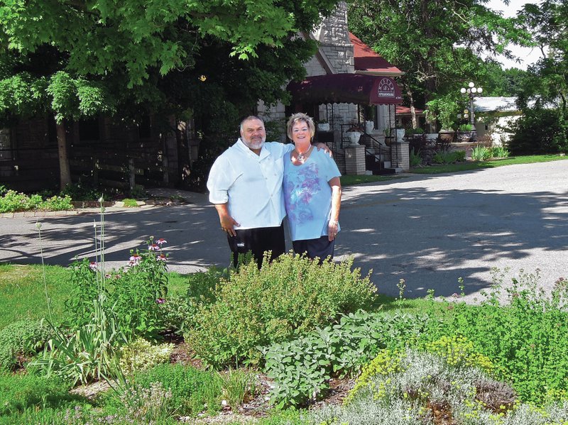 Bruce Barnes (left) and his wife, PJ, own and operate Mister B&#8217;s Steakhouse out of a renovated 1930s-era home one mile west of downtown Rogers.