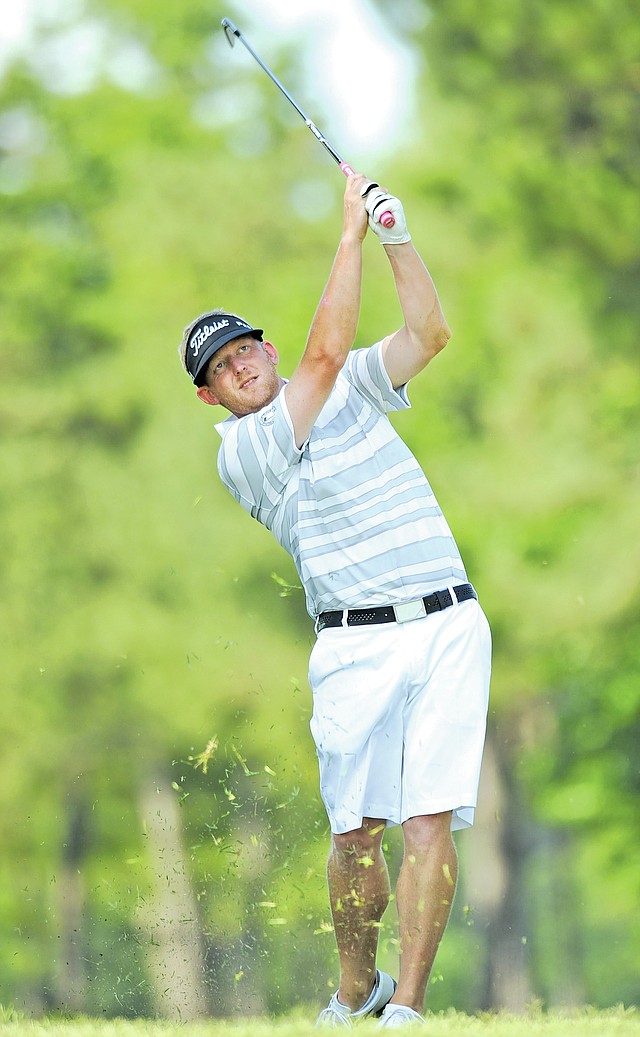 STAFF PHOTO ANDY SHUPE Steven Dixon watches his shot sail to the 11th green Sunday, June 16, 2013, during the final round of the Dwight Collins Chick-A-Tee Invitational at Springdale Country Club. Dixon returns as the defending champion for the 76th Chick-A-Tee which begins today.