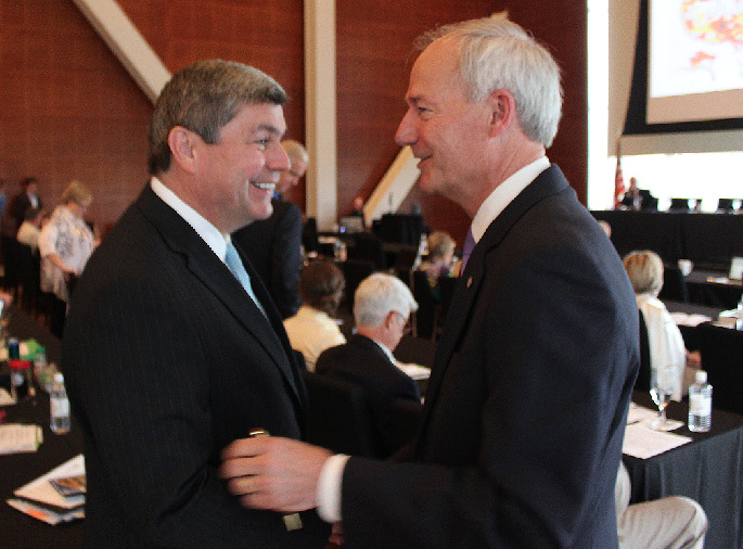 Gubernatorial candidates Mike Ross, left, and Asa Hutchinson, shake hands Friday during the Delta Grassroots Caucus conference in Little Rock.