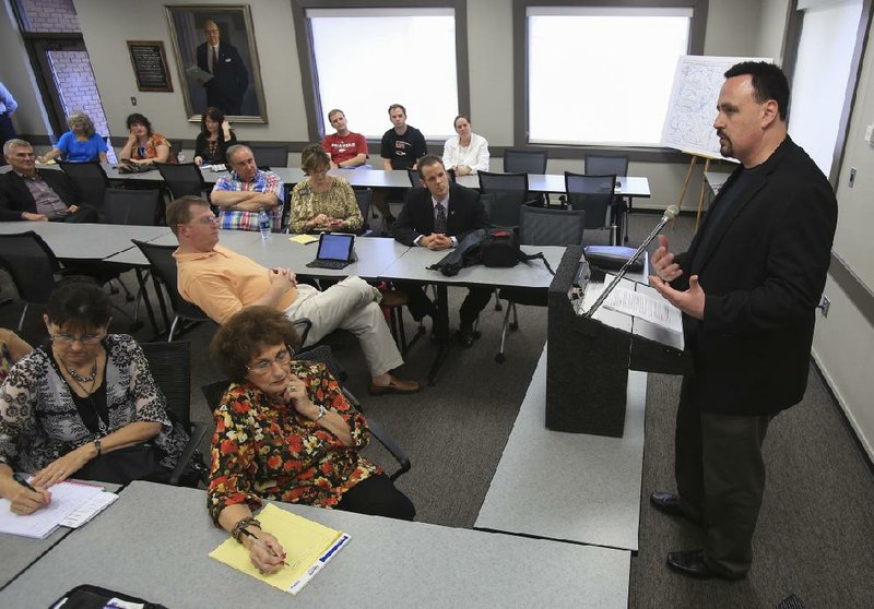  Arkansas Democrat-Gazette/STATON BREIDENTHAL --6/13/14-- Sgt. Jim Gerhardt (at podium) of the Denver North Metro Drug Task Force speaks Friday afternoon about legalized marijuana in Colorado at the Arkansas State Chamber of Commerce in Little Rock. 