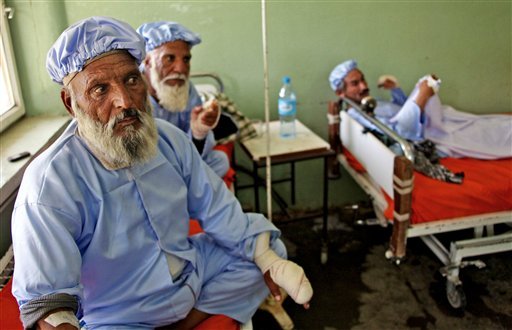 Afghan men, who their fingers have been cut off by Taliban fighters as a punishment for voting, rest in a hospital in Herat, west of Kabul, Afghanistan, Sunday, June 15, 2014. A roadside bomb killed many people in Afghanistan, including election workers, and the Taliban cut off the fingers of nearly a dozen people to punish them for voting in this weekend’s presidential runoff, officials said Sunday.