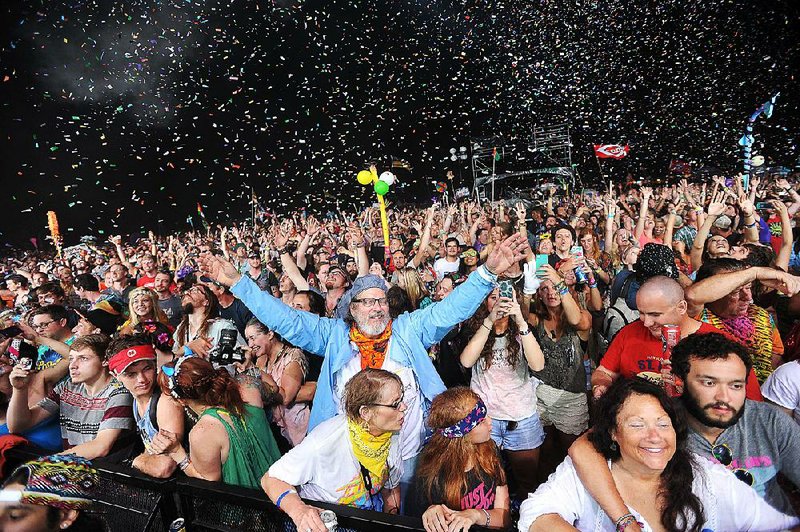 NWA Media/Michael Woods --06/06/2014-- w @NWAMICHAELW...Wakarusa fans get showered with confetti as Flaming Lips begins their show on the main stage Friday night during the 2014 Wakarusa music and camping festival on Mulbery Mountain in Ozark, Arkansas. The 2014 Wakarusa music and Camping Festival features 4 days of music and activities for people of all ages through Sunday night.  