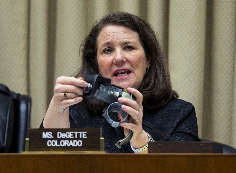 Rep. Diana DeGette, D-Colo., holds up an ignition switch in April while she questions General Motors Chief Executive Officer Mary Barra on Capitol Hill in Washington.