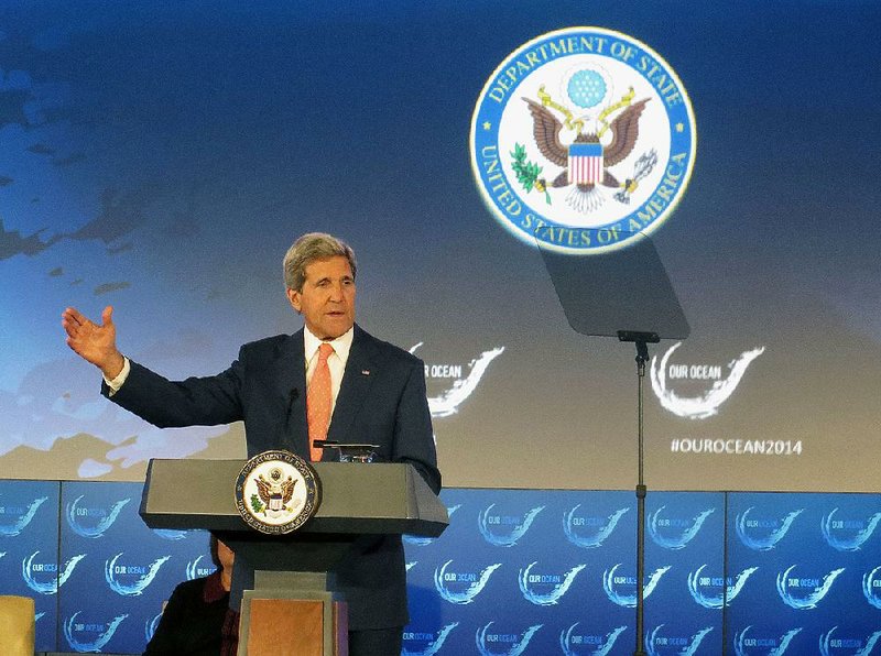 Secretary of State John Kerry addresses the Our Ocean conference Monday at the State Department in Washington. President Barack Obama’s administration is willing to talk with Iran about deteriorating security conditions in Iraq and is not ruling out potential U.S.-Iranian cooperation in stemming the advance of Sunni extremists, Kerry said Monday.
